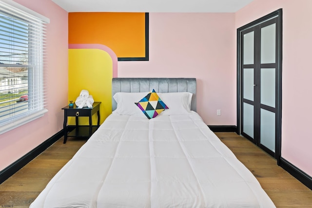 bedroom featuring hardwood / wood-style floors