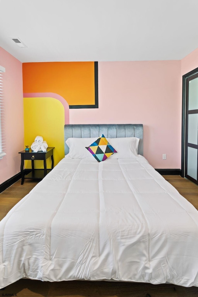 bedroom with wood-type flooring