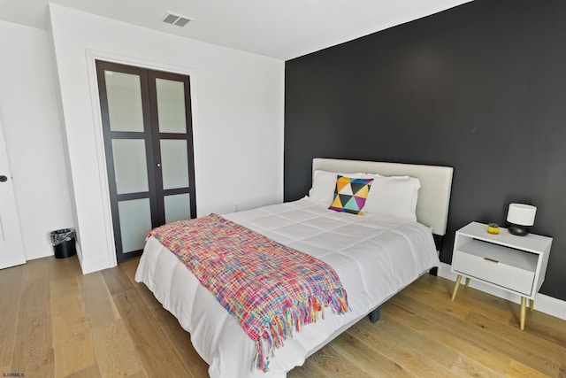 bedroom featuring wood-type flooring