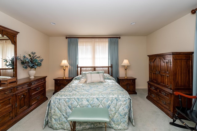 bedroom featuring light colored carpet