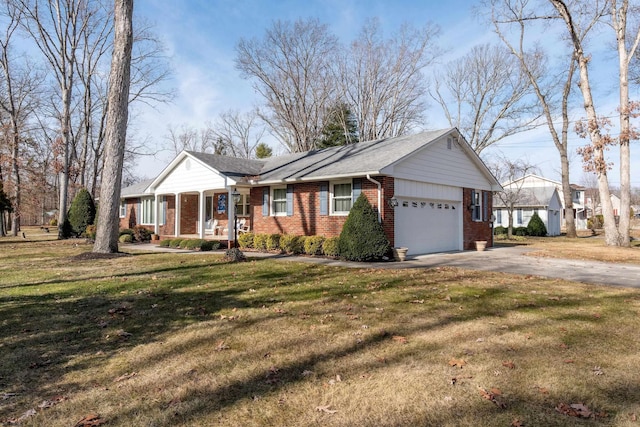 single story home with a garage and a front yard