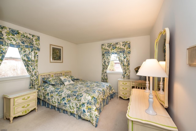 bedroom featuring light carpet