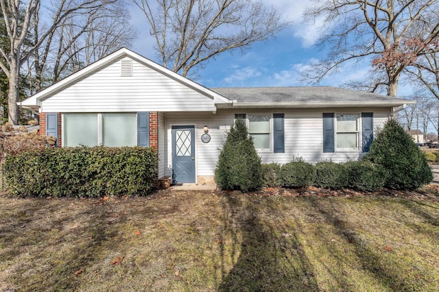 ranch-style house with a front lawn