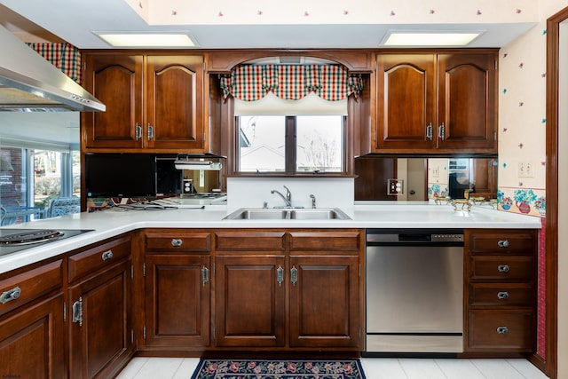 kitchen with dishwasher, sink, light tile patterned floors, gas stovetop, and wall chimney exhaust hood