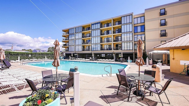 view of pool featuring a patio area