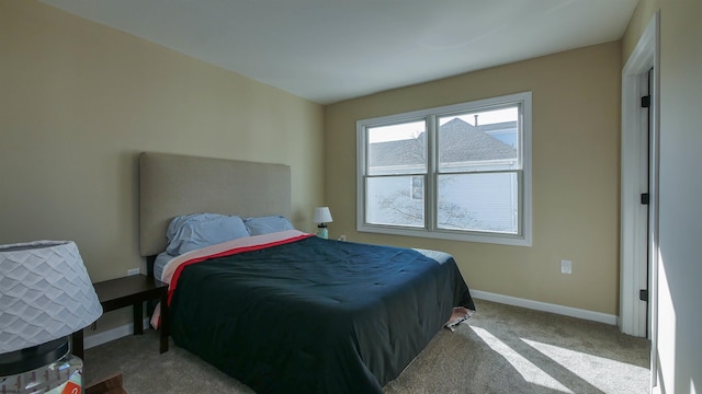 bedroom featuring light colored carpet