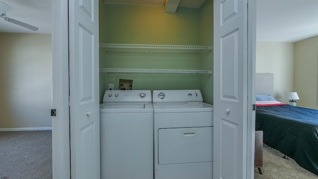 laundry room featuring ceiling fan, light colored carpet, and washing machine and dryer