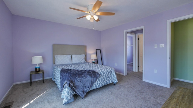 bedroom with ceiling fan and carpet floors