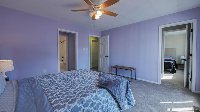 bedroom featuring ensuite bathroom, carpet floors, and ceiling fan