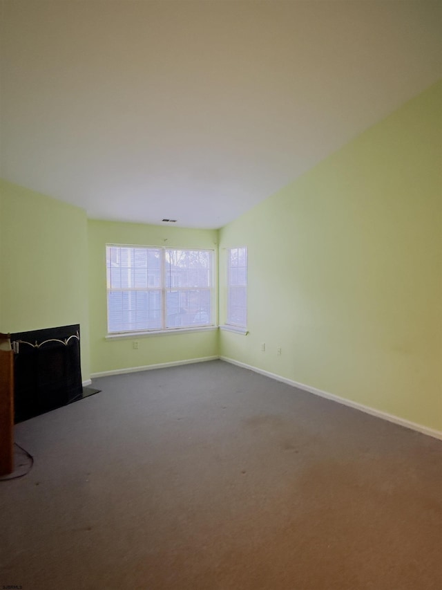 unfurnished living room featuring carpet flooring