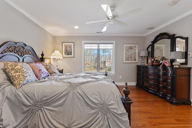 bedroom featuring crown molding, ceiling fan, and dark hardwood / wood-style flooring