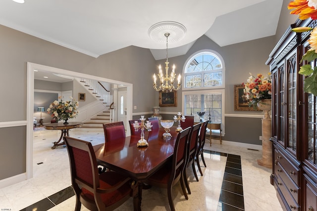 dining space featuring lofted ceiling and a chandelier