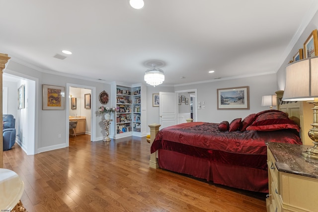 bedroom with ensuite bath, ornamental molding, and hardwood / wood-style floors