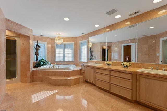 bathroom with plus walk in shower, tile walls, and vanity