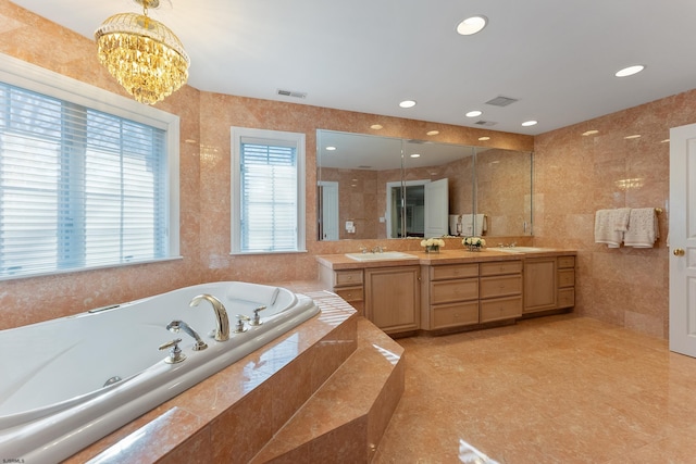 bathroom with vanity, independent shower and bath, and tile walls