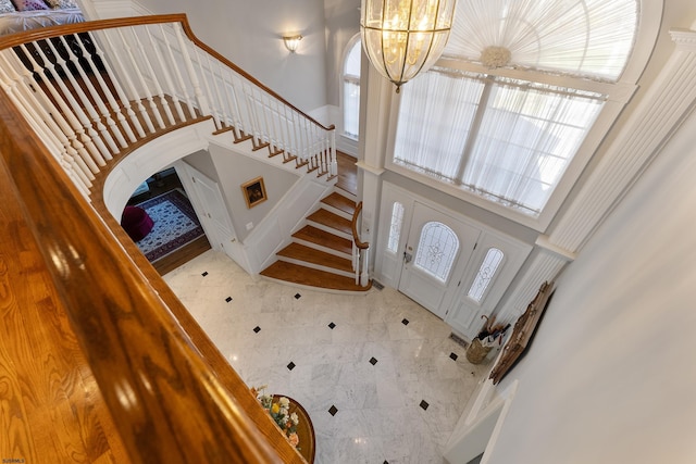 entrance foyer with a notable chandelier and a high ceiling