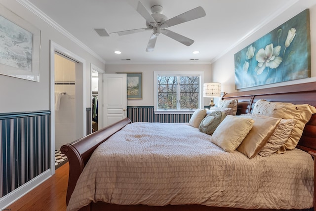 bedroom featuring wood-type flooring, ornamental molding, and ceiling fan