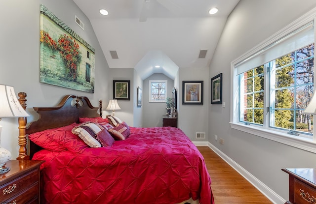 bedroom featuring vaulted ceiling and light hardwood / wood-style floors