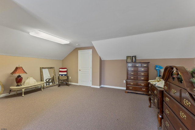 interior space with lofted ceiling and carpet flooring