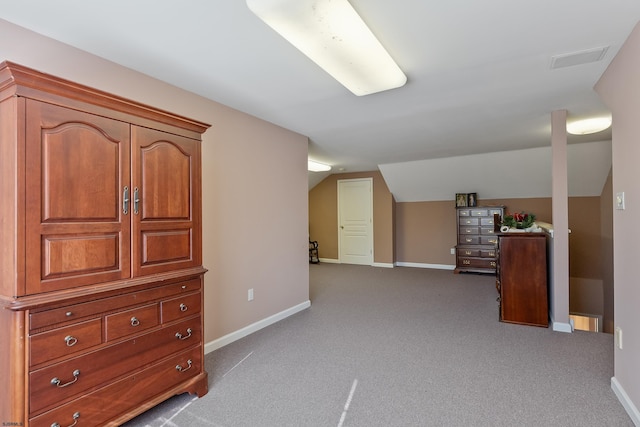 additional living space with lofted ceiling and carpet flooring