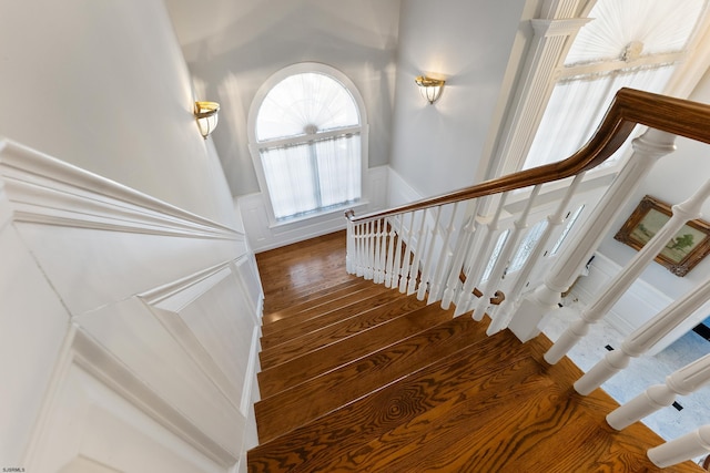 staircase with wood-type flooring