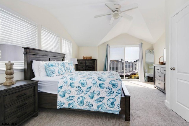 carpeted bedroom featuring ceiling fan, vaulted ceiling, and access to outside