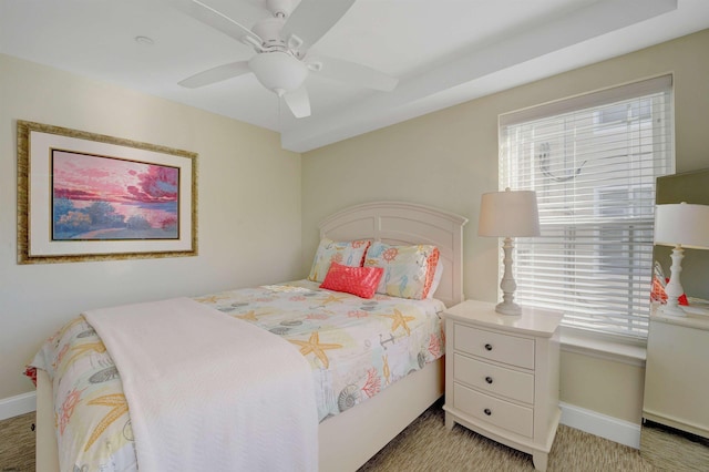 bedroom with multiple windows and ceiling fan