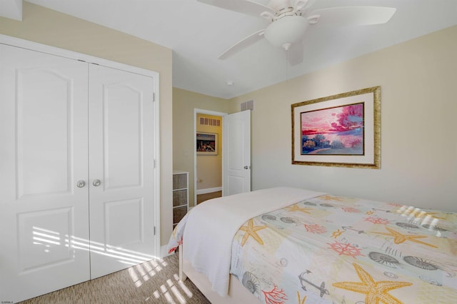 bedroom with ceiling fan and a closet