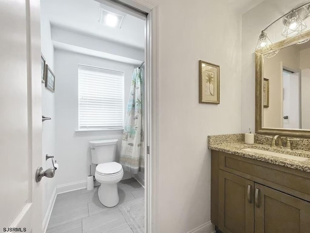 bathroom featuring tile patterned flooring, vanity, a shower with curtain, and toilet