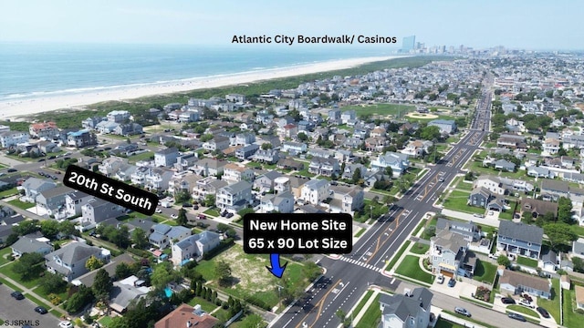 aerial view featuring a beach view and a water view