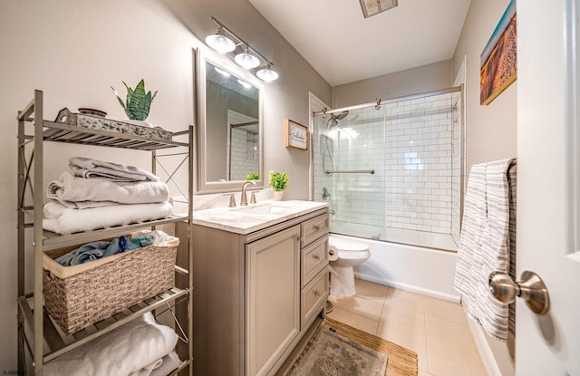 full bathroom featuring toilet, tile patterned floors, shower / bath combination with glass door, and vanity