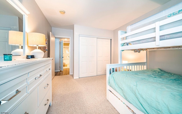 carpeted bedroom featuring a closet