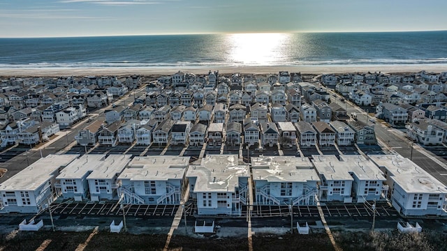 birds eye view of property with a water view and a view of the beach