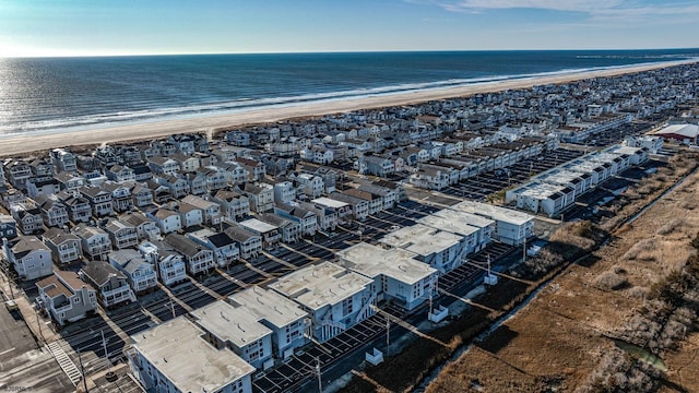 aerial view featuring a view of the beach and a water view