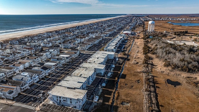 aerial view featuring a water view and a beach view