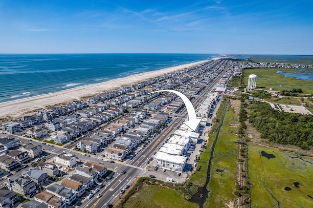 bird's eye view with a beach view and a water view