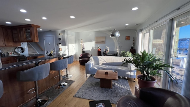 living room with light hardwood / wood-style flooring