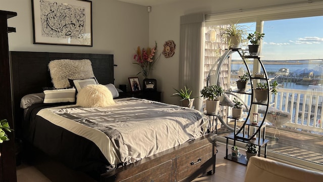 bedroom featuring a water view