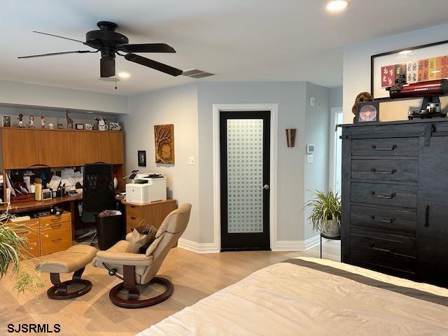 interior space with ceiling fan and light wood-type flooring