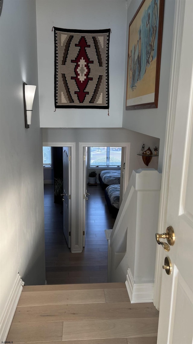 corridor featuring hardwood / wood-style floors