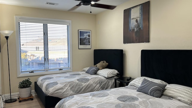 bedroom featuring hardwood / wood-style flooring and ceiling fan