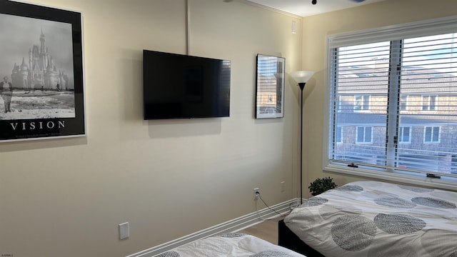 bedroom with wood-type flooring