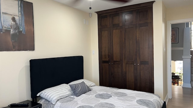 bedroom with hardwood / wood-style flooring and a closet