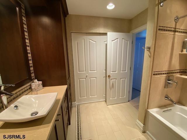 bathroom featuring vanity and bathtub / shower combination