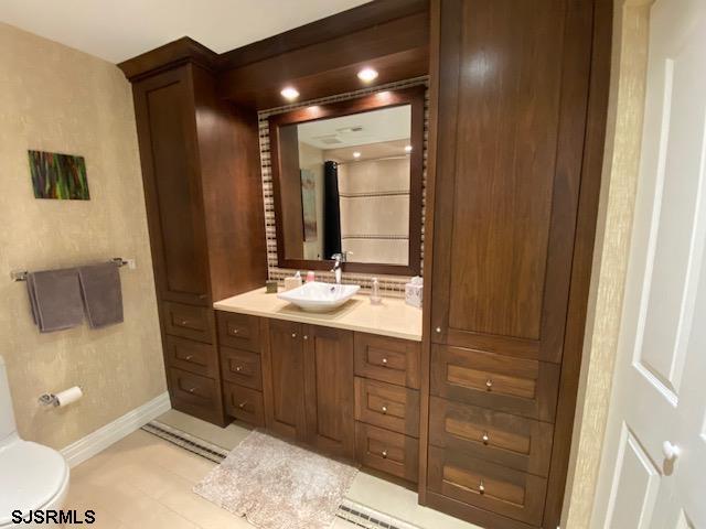 bathroom featuring vanity and toilet