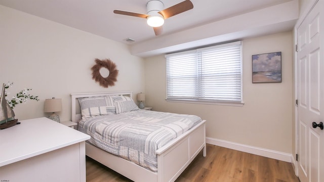 bedroom featuring hardwood / wood-style floors and ceiling fan