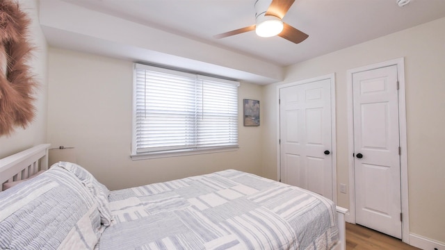 bedroom featuring ceiling fan and light hardwood / wood-style floors