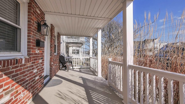 wooden deck featuring covered porch