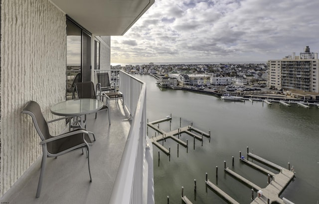 balcony featuring a water view