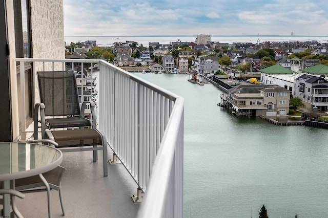 balcony featuring a water view